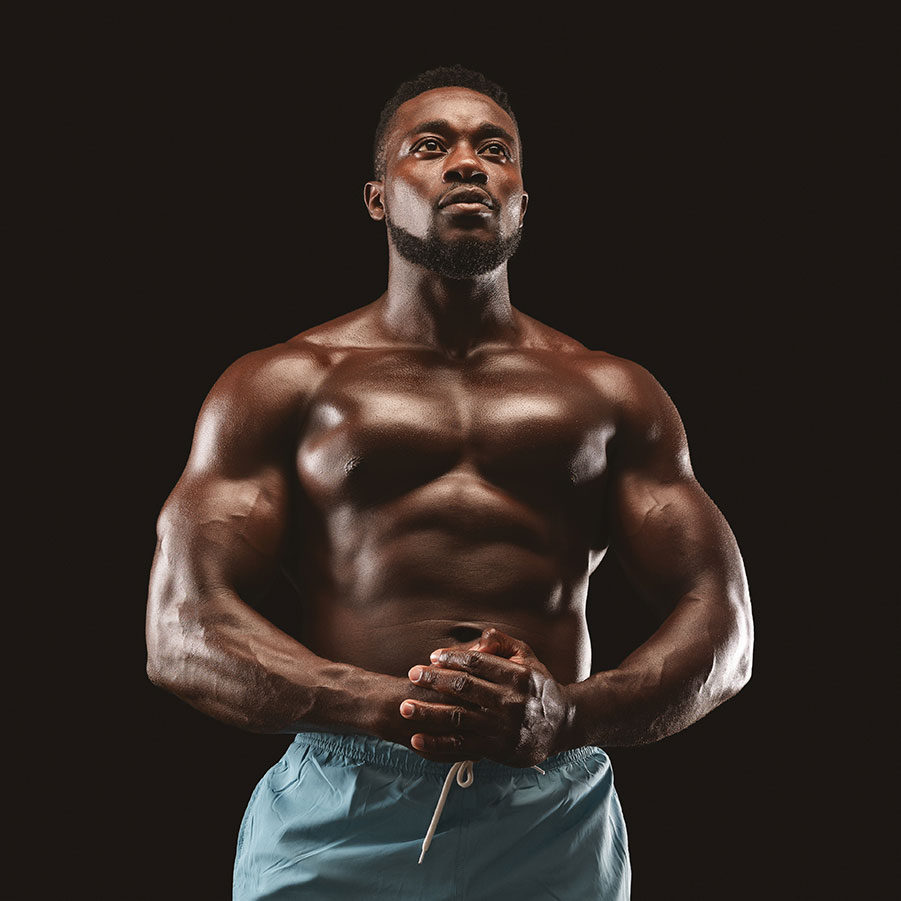 portrait-of-handsome-muscular-sportsman-demonstrat